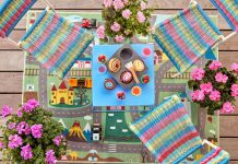 Ένα ολάνθιστο οικογενειακό σπίτι με γεράνια