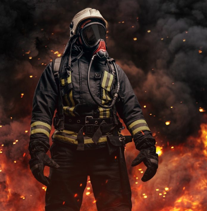Professional,Firefighter,Dressed,In,Special,Uniform,With,Gas,Mask