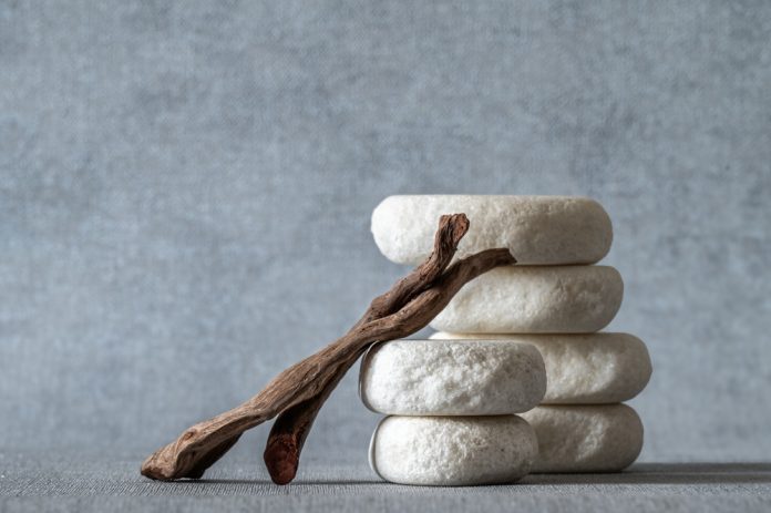 Empty,Stone,Podium,,Pieces,Of,Snag,On,Grey,Background.,Minimalist