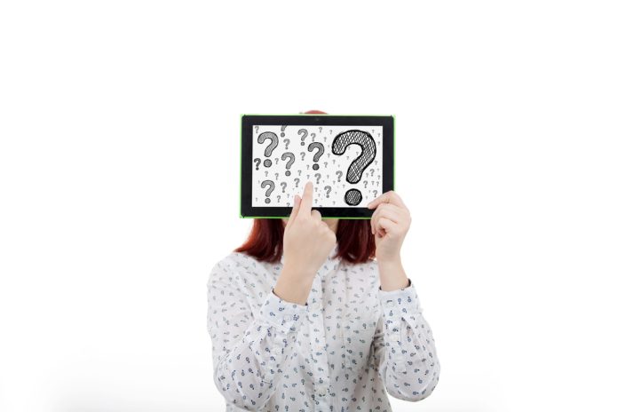 Portrait,Of,Confused,,Thinking,Young,Businesswoman,Seeks,A,Solution,,Covering