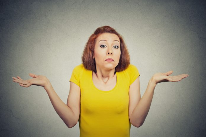 Closeup,Portrait,Puzzled,Clueless,Young,Woman,With,Arms,Out,Asking