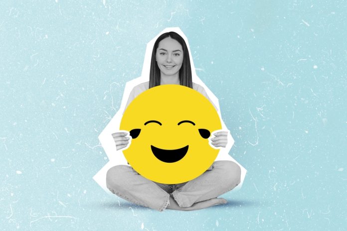 Happy,Girl,Holding,Large,Laughing,,Crying,Smiley,Emoji,Collage,Isolated