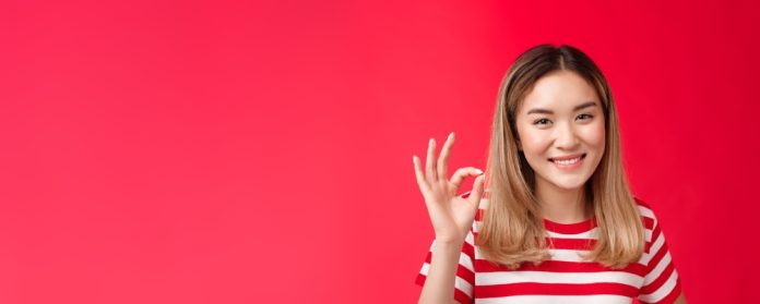 Close-up,Friendly,Satisfied,Carefree,Young,Asian,Blond,Girl,Show,Approval