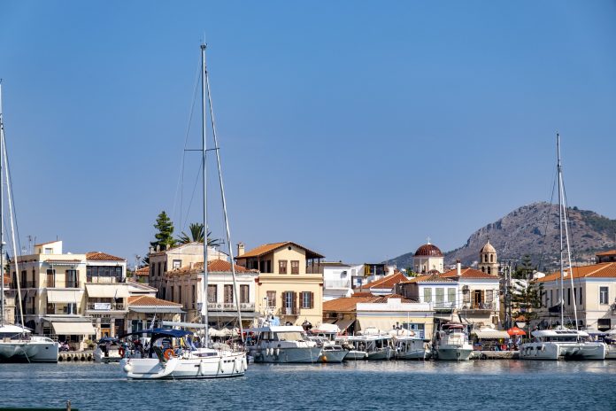 Sailing boat approaching Aegina town from sea