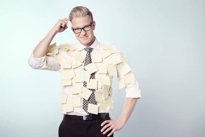 Confused,Businessman,Wondering,While,Being,Covered,By,Many,Empty,Yellow