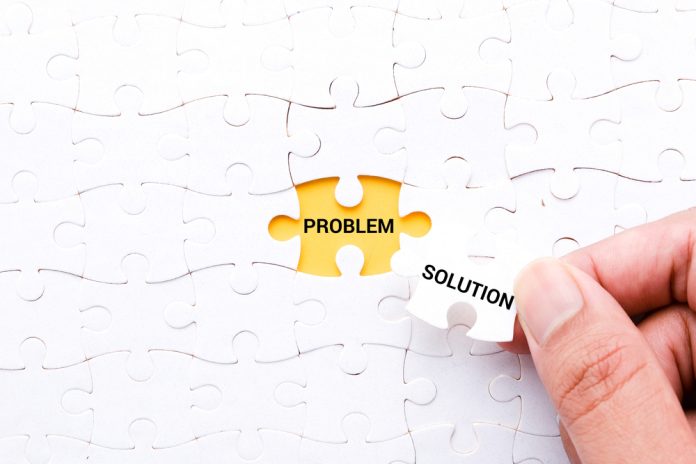 A,Picture,Of,Hand,Try,To,Put,"solution",Jigsaw,Puzzle