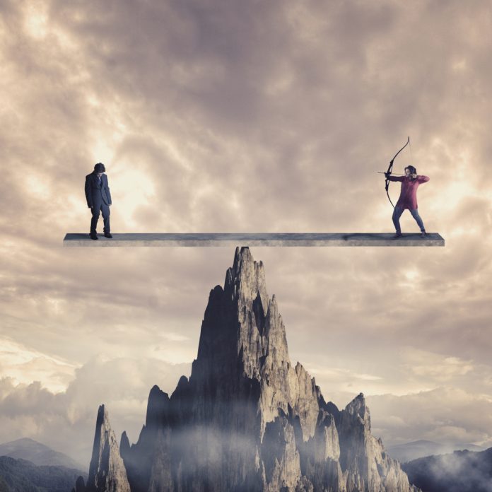 Archer,Aim,To,Shoot,A,Weak,Man,On,A,Balance