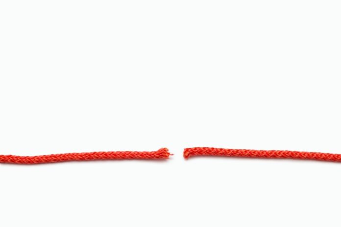 Red,Rope,Cut,Into,Two,Parts,On,A,White,Isolated