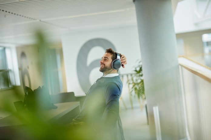 Business,,Man,And,Relax,With,Headphones,In,Office,For,Work