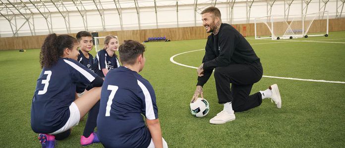 Sir David Beckham coaching young people