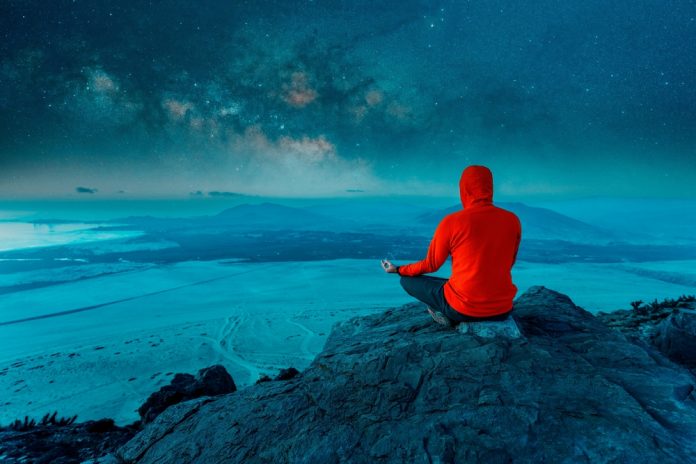 Unknown,Person,Sitting,On,The,Top,Of,The,Mountain,Meditating