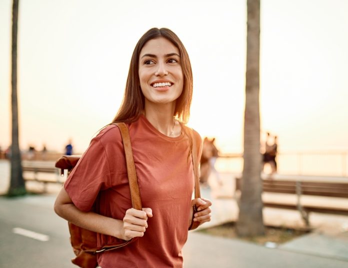 Portrait,Of,A,Smiling,Young,Woman,Girl,Walking,In,The