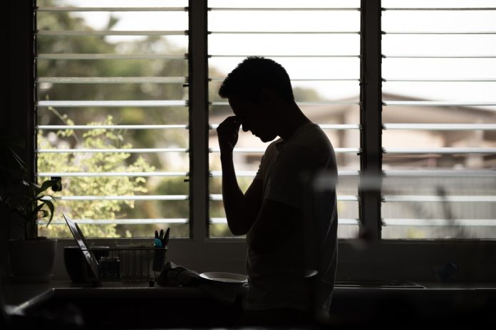 Silhouette,Of,Young,Man,At,Home,Feeling,Tired,And,Emotional