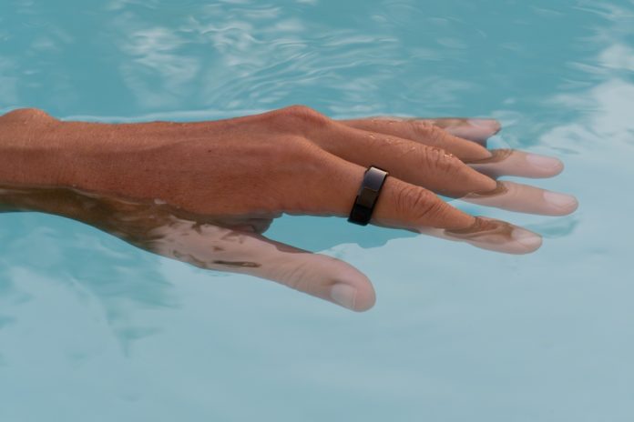 Hand,,Submerged,In,Clear,Pool,Water,Showcasing,A,Sleek,Waterproof