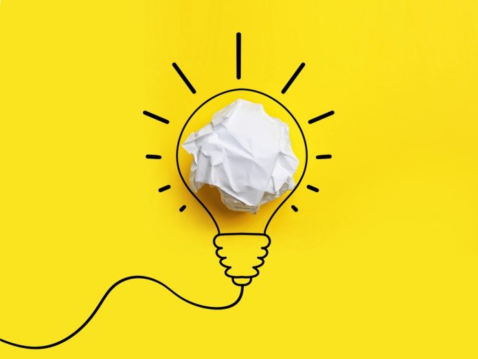 Idea.,Illustration,Of,Light,Bulb,Around,Crumpled,Paper,Ball,On